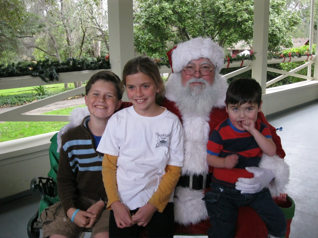 Sadly Wilson missed out on this tradition due to a trip up north for a drum corps camp but the rest of the clan enjoyed the requisite visit with Santa...