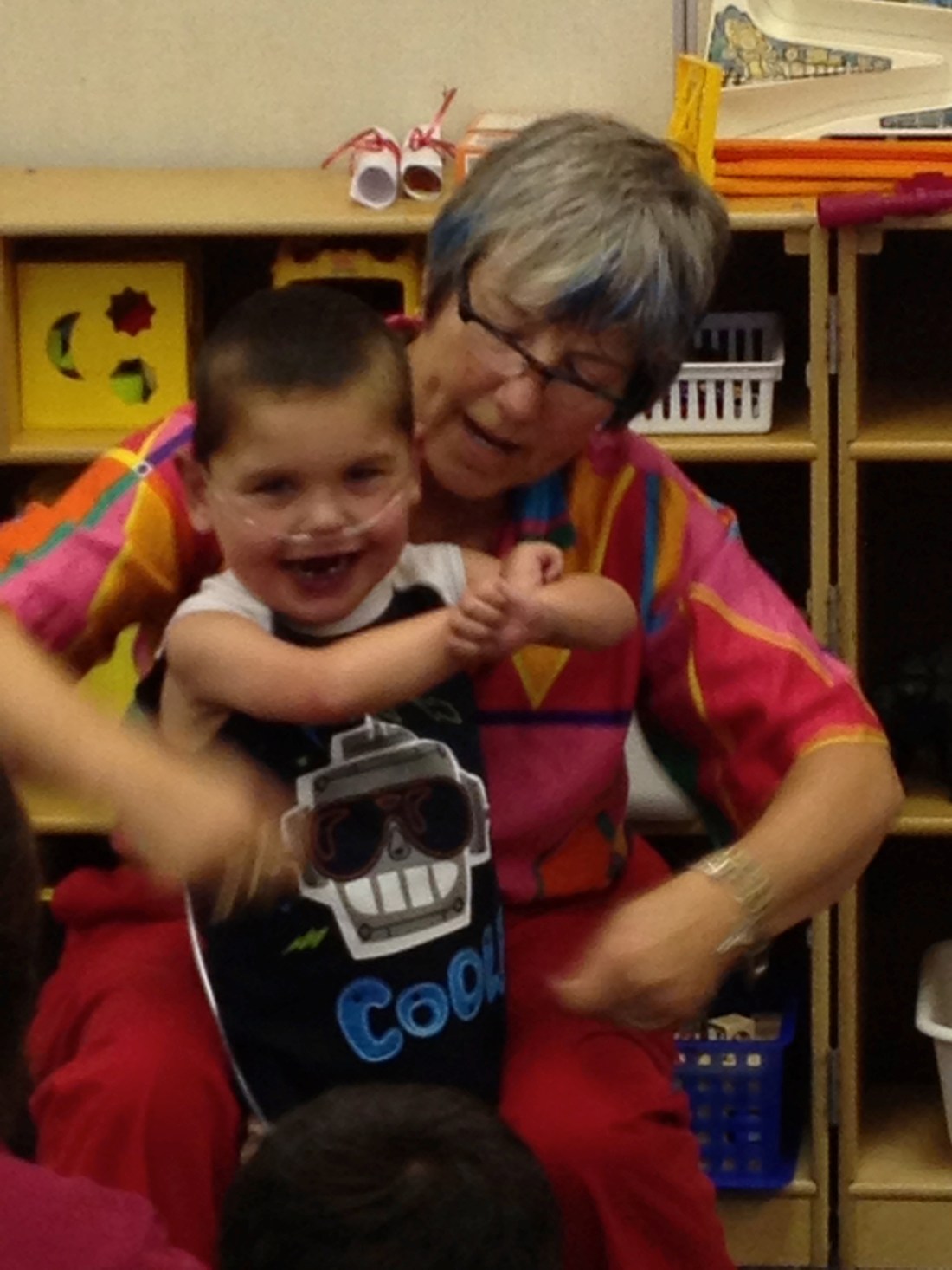 Song leader Rudy with the help of teacher Diane.