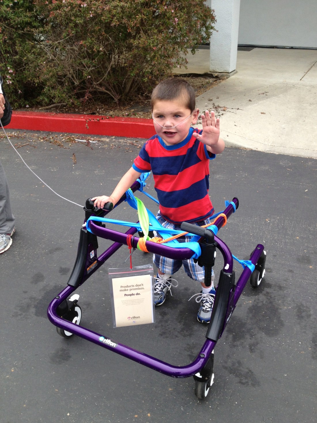 Rudy proudly waving while going for a walk during therapy early last week!