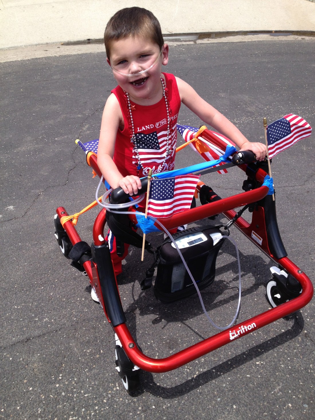 Rudy got his new, "hand-me-down" walker on Monday...his cherry red hot rod has already made a few rounds around the cul-de-sac!!!