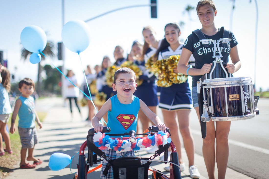 After hesitating at the start of the Heart Walk, Rudy saw Wilson step out of the drum line at this moment and was quick to catch up to him!  His expression says it all!!