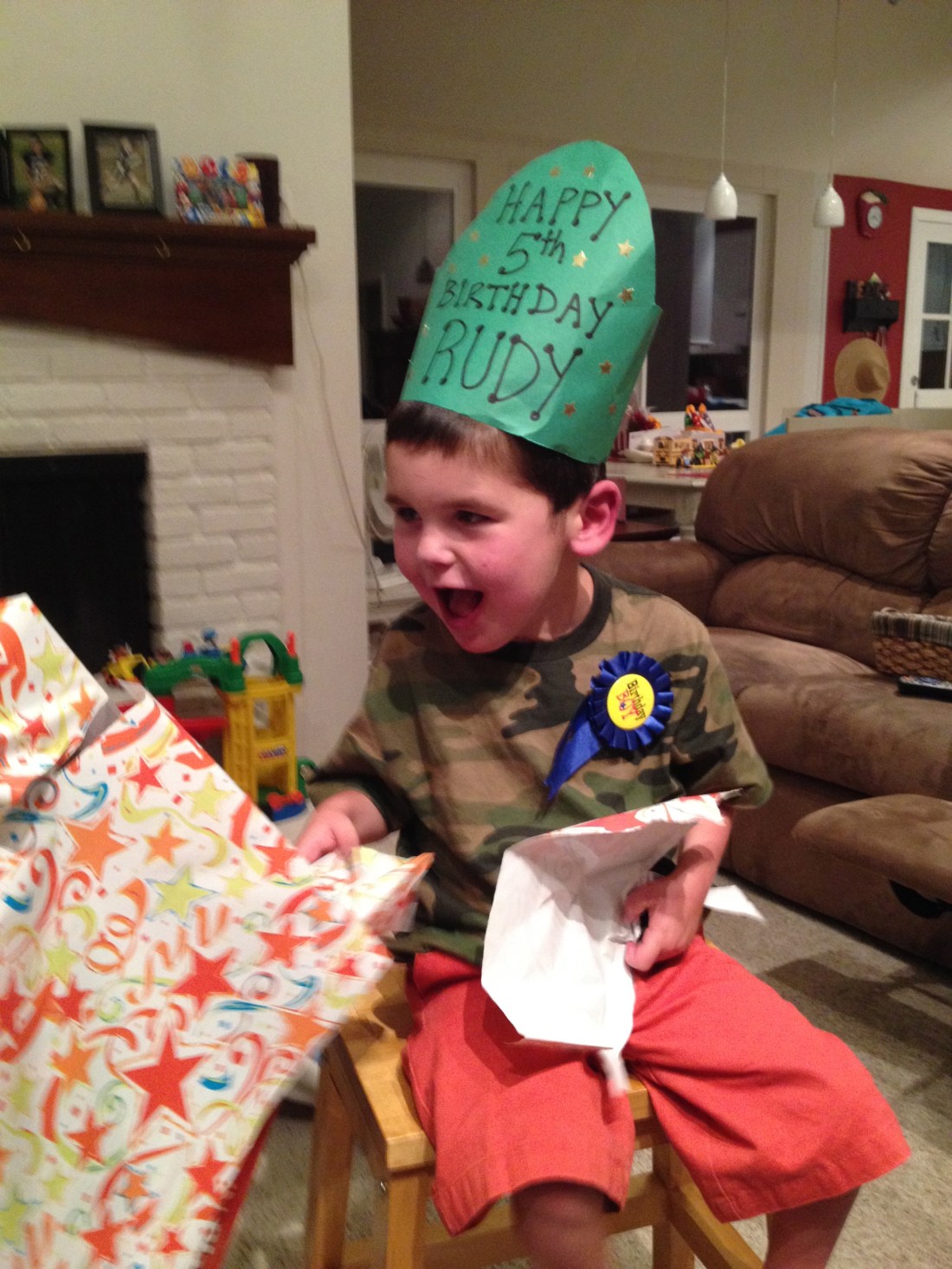 Rudy had fun opening his own presents with Olivia's help