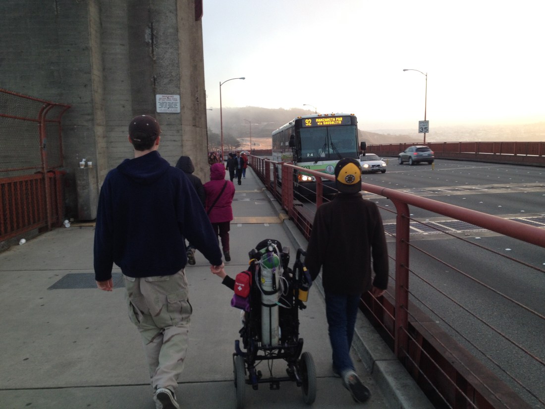 A band of brothers walking on a bridge!