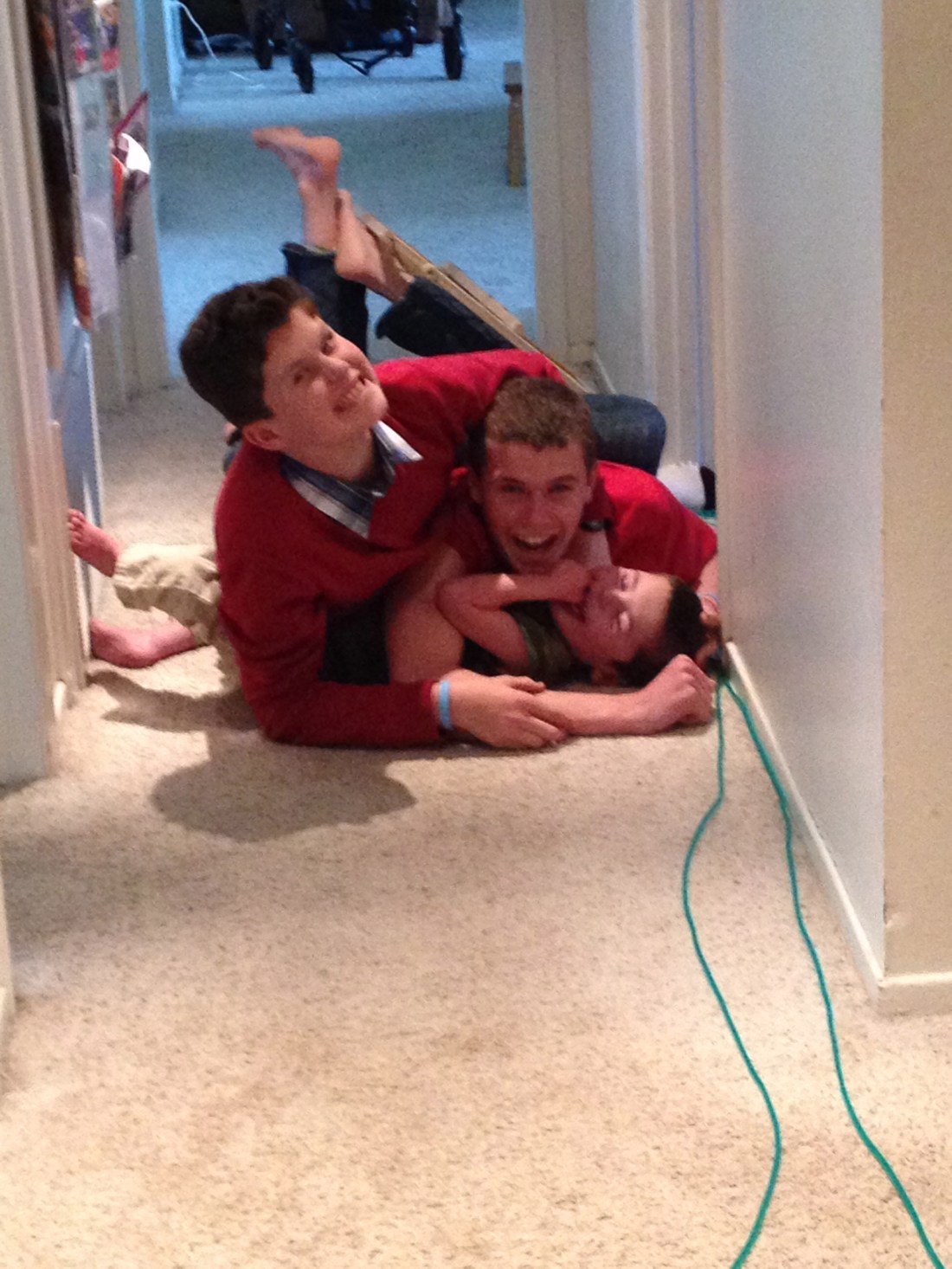 Came home from dropping Olivia off at Volleyball practice to find the boys wrestling in the hallway…Boys!