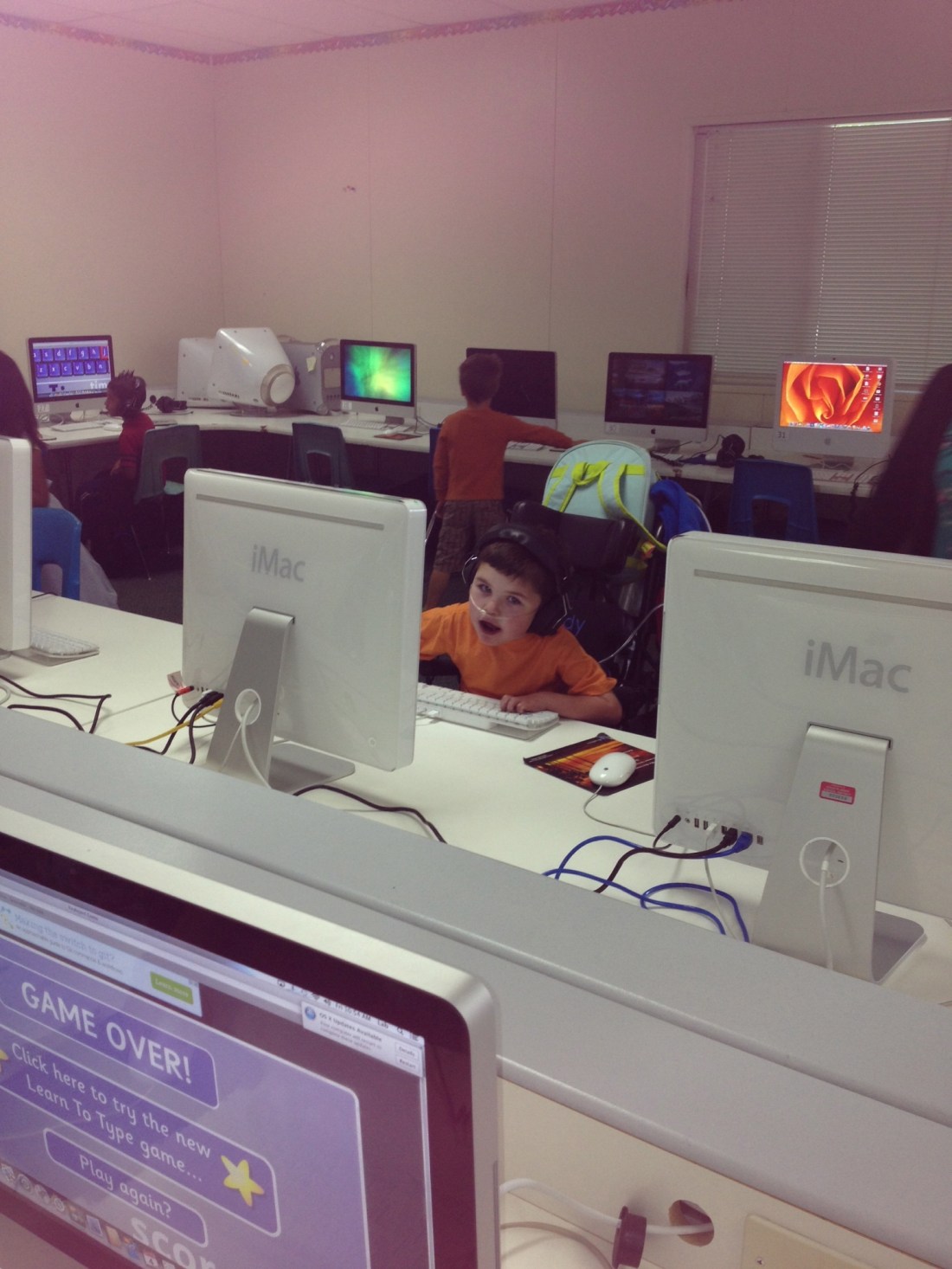 Rudy's first experience in the computer lab at school!  Nurse Sara texted me this pic with the caption "Rudy's dream day at school...a room full of computers".  :)  LOVE it!!