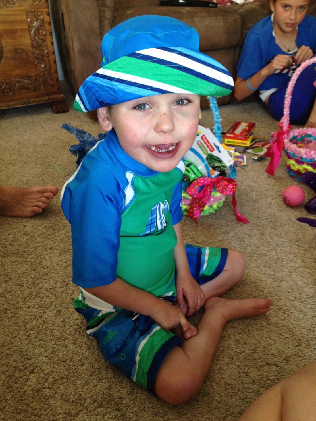 The Easter bunny brought Rudy new swim attire!  The black eye?  Not sure where that came from...it was either from all the bounce house fun from the day before OR from wrestling with big brothers!  Ha Ha  