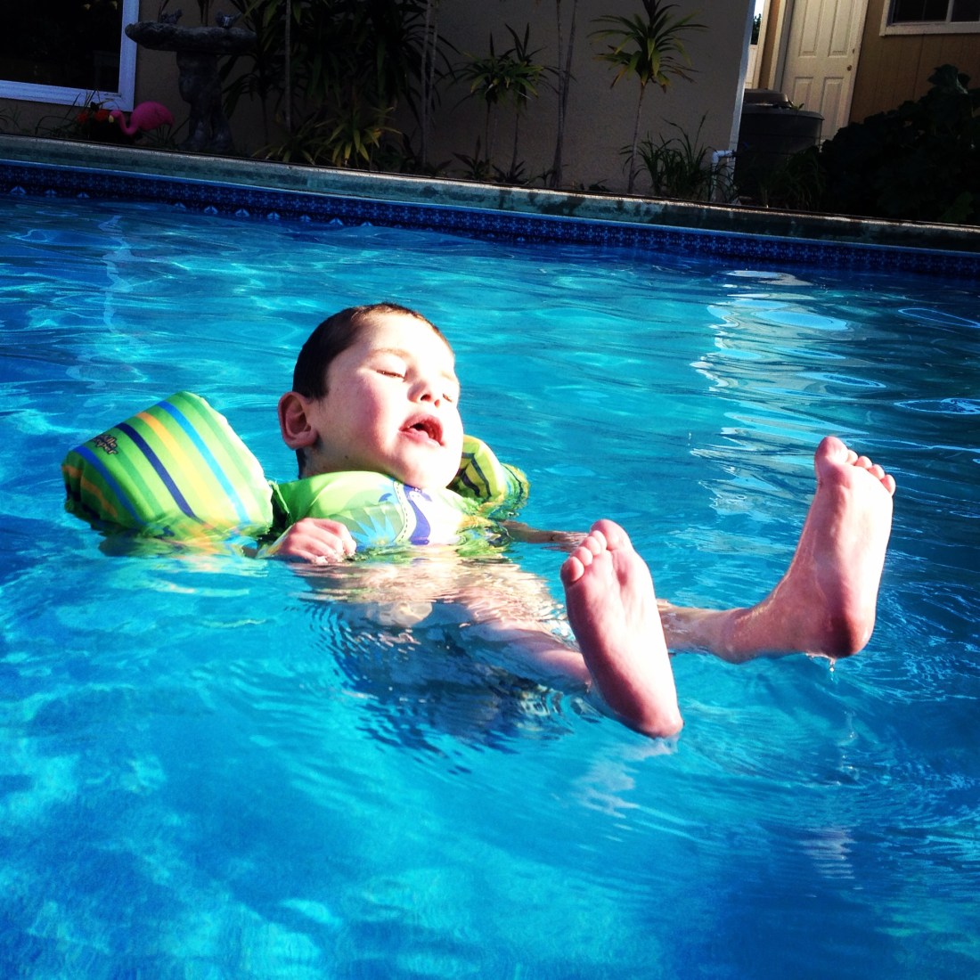 It's official!  Swim season is upon us and with the pool a comfortable 85 degrees...it's warm enough for Rudy to enjoy too!  Without the trach stoma, Rudy can enjoy a little independent pool time and he's taking every advantage of having a pool in the backyard!  Ha Ha
