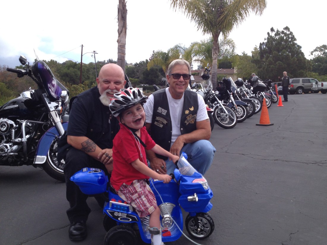 Chillin' with the Black Sheep Harley Club at church!  Rudy was pretty proud of his hog among the lineup of Harleys...