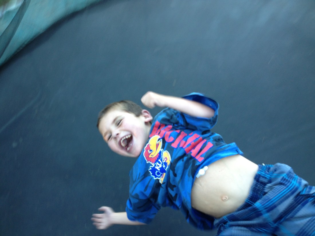 Wilson had some fun with Rudy on the trampoline a few weeks ago…it's a good thing I wasn't aware of how high Wilson was bouncing Rudy or he probably would have missed out on some BIG fun!!  Look at that smile!!...