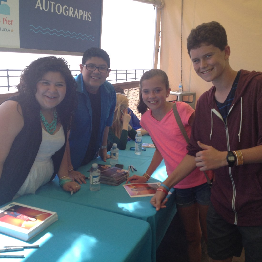 ..getting autographs from another "Modern Family" cast member Rico Rodriguez and his sister Disney Star Raini Rodriquez...