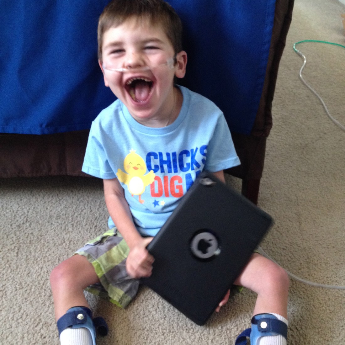 Apparently, a boy + an IPad = a big smile