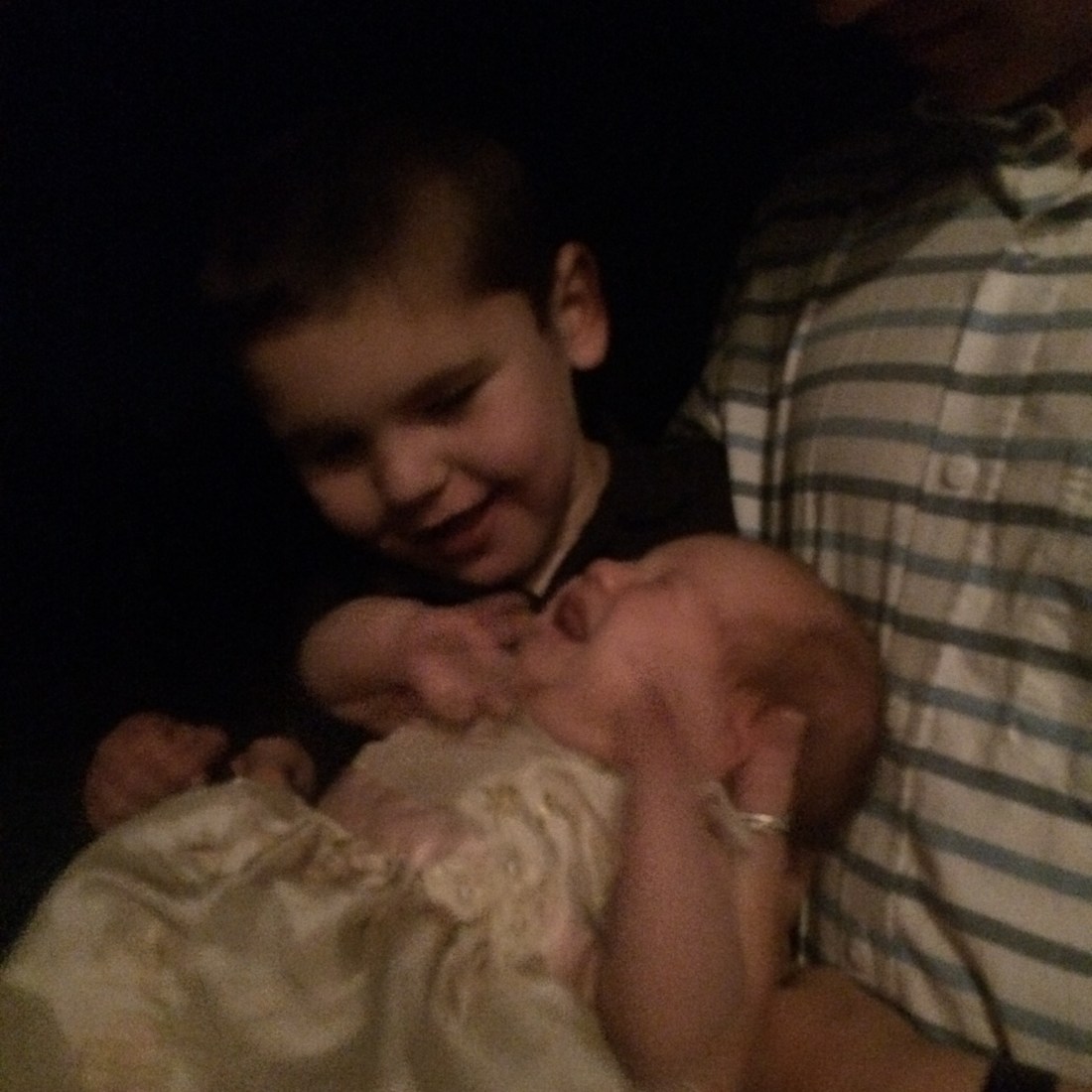 Rudy getting acquainted with the bride's brand new niece...Baby Evie!