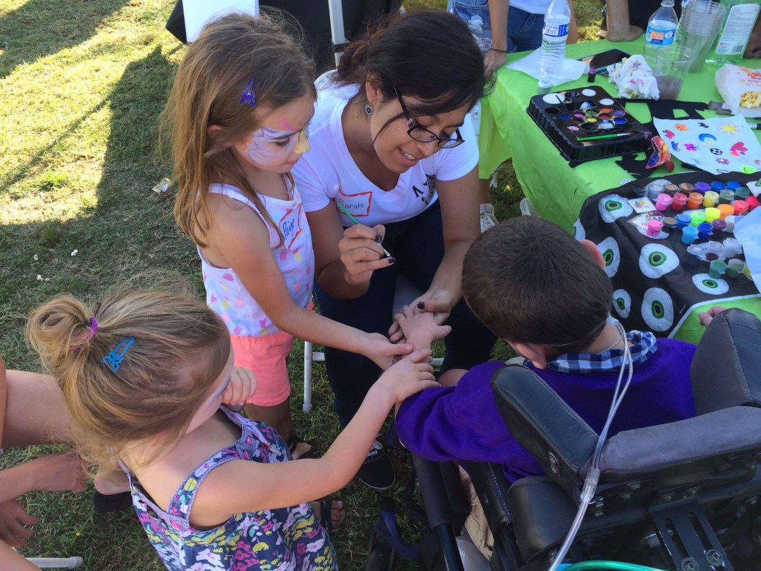 Friends Paige and Ava helped steady Rudy's hand during a session with the face painter! :)