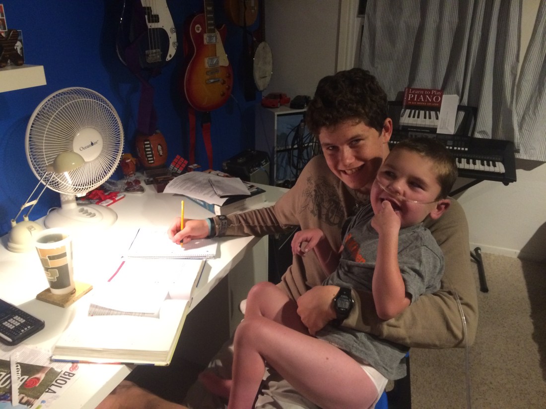 Rudy doing his best to distract Max from doing his homework!!!