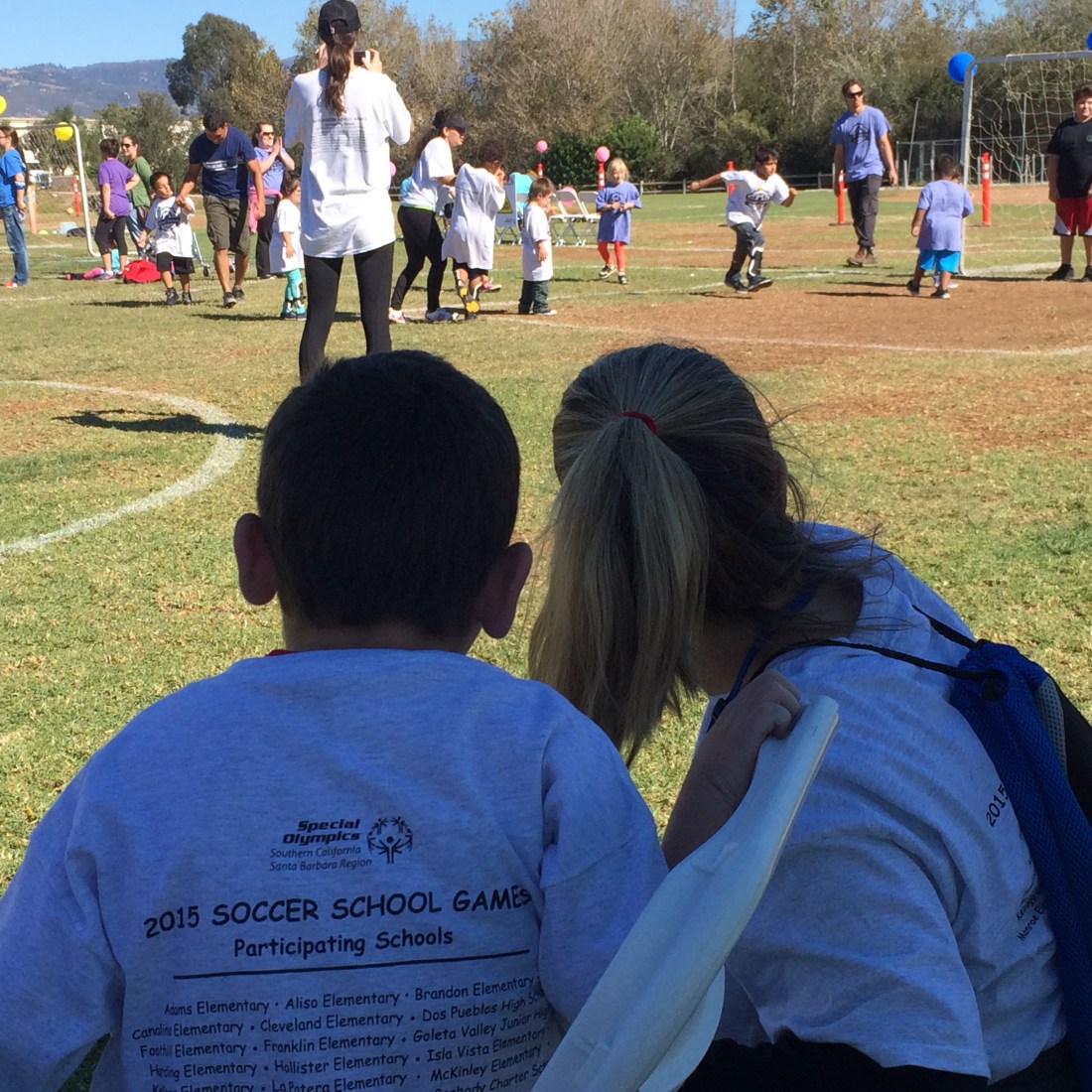 Checking out the game in progress with nurse Sara from the sideline...